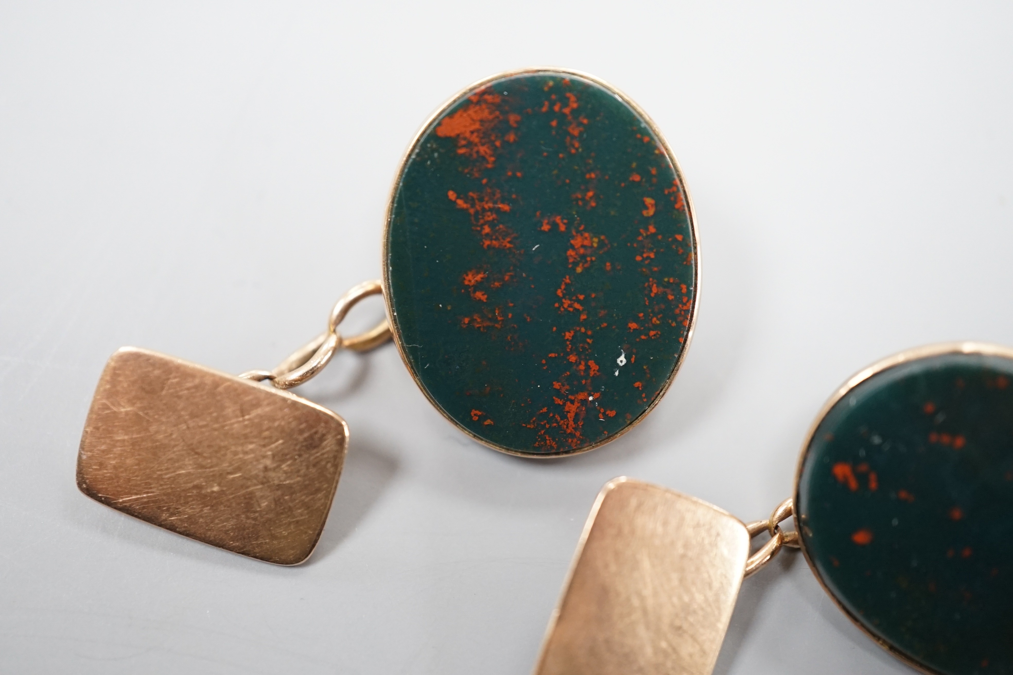 A pair of 9ct and oval bloodstone set cufflinks, 22mm, gross weight 10.4 grams.